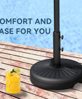 Beefy 82Lb Water Filled Outdoor Umbrella Base Stand for Patio and Garden with drink and poolside background