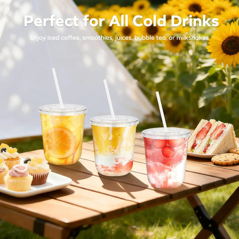 Clear 12 Oz Cups With Lids And Straws 50 Pack For Iced Coffee Smoothies Milkshakes Juices To Go Durable BPA Free PET Plastic outdoors on a table