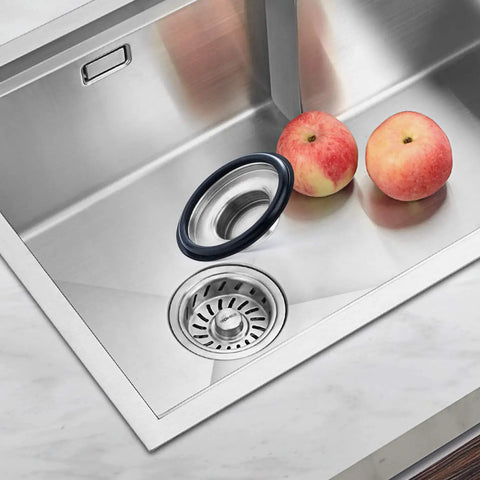 Two Pack Stainless Steel Kitchen Sink Stopper Sets With Large Wide Rim Three Point Three Five Inches Diameter No Tools Needed Easy Replacement For Splash Guards Keeps Food And Debris From Splashing Up Fits Standard Drains Value Packed displayed in a modern kitchen sink setting with apples nearby.