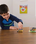 Child playing with Deluxe 3 Pack John Deere Farm Toy Set With Free Rolling Wheels Tractors Gator And Skid Steer In Collectible Display Box