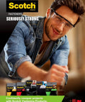 Man using Scotch fasteners for home project, featuring various Scotch products, tagline 'Seriously Strong.'