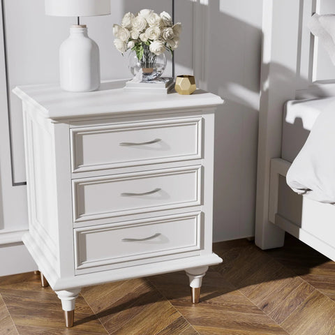 White dresser with three brushed nickel cabinet pulls, arch twisted design, placed in a bedroom setting with wood flooring.