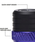 Close-up of a knurled grip on the 5 Piece Bit Holder Keychain Set For Quarter Inch Hex Bits With Carabiner Clip And Color Coded Bands.