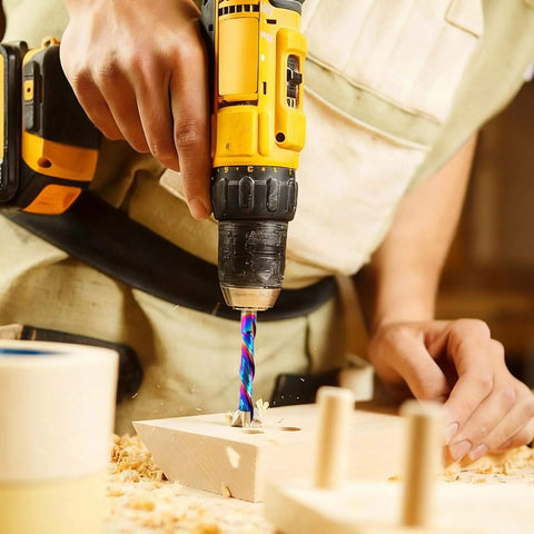Person using drill with Pro Grade One Quarter Inch Shank Compression Router Bit Extra Long Four Inch Overall Length Two Inch Cutting Length DLC Coated