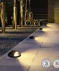 6W Well Lights Landscape LED Kit Pack Of 6 No Glare Outdoor In Ground Lights illuminating garden pathway at night, 320 Lumens
