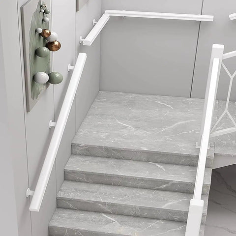 Rugged White Solid Wood Guardrail Loaded With Beefy Steel Brackets For Indoor Attic Or Stairway Safety Barrier Built Like A Tank Non Slip Grip Kid Approved Home Defense Six Point Six Feet Long installed on gray marble stairs.