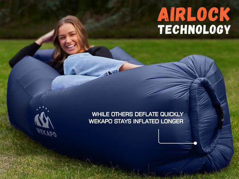 A person relaxing on an Inflatable Couch Air Lounger Chair No Pump Needed For Camping And Beach Trips, blue color, outdoor lawn setting.