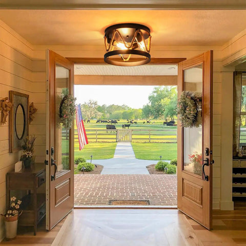Interior view showcasing Industrial Three Light Farmhouse Ceiling Fixture With Rope Shade In Rustic Black Metal in entryway.