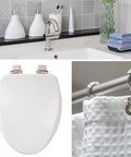 Image showing a Soft Close Toilet Seat With Brushed Nickel Hinges, Round, High Density Enameled Wood, White, in a bathroom setting.