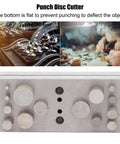 14 Piece Round Disc Cutter Set 2.7 To 16 mm Punch Die Kit for jewelry making and metal craft with flat bottom design on table.