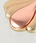 Close-up of gold metal cabinet knob, part of Modern Metal Cabinet Door Knobs And Wardrobe Drawer Pulls For Single Hole Install.