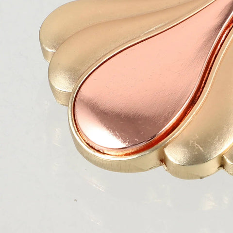 Close-up of gold metal cabinet knob, part of Modern Metal Cabinet Door Knobs And Wardrobe Drawer Pulls For Single Hole Install.