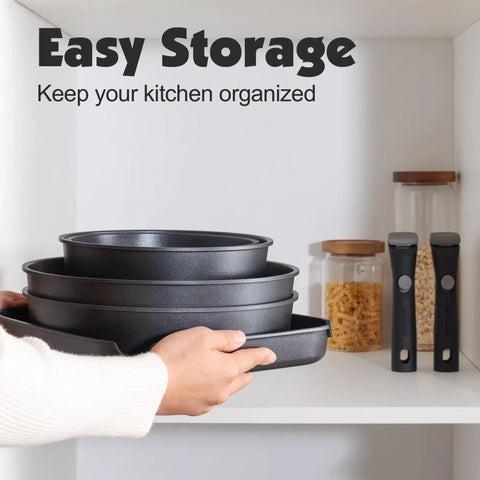 Person stacking Nonstick 17 Piece Pots And Pans Set With Removable Handles Induction Ready Cookware For RV And Home in cabinet