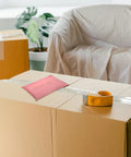 Pink 15x27cm Self Sealing Poly Mailer Bags Pack Of 100 Tear-Resistant Shipping Mailers for Small Business on taped box