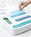 Hand using StoraBag Drawer Food Bags Dispenser For Kitchen Storage 4 Slot Plastic Sandwich Bag Organizer on countertop