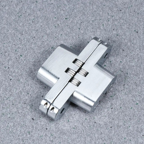 Concealed Cross Hinges Set Of Two In 304 Stainless Steel for table and counter doors on a gray surface