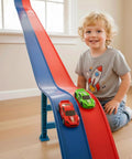 Child playing with Flexible Fifteen-Foot Fun-Filled Kids Race Track With Two Toy Cars Safe US-Certified PVC indoors