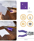 One Sixteenth Inch Circle Hole Punch With Ergonomic Cushioned Grip, purple accent, in use for crafting and on table close-up.