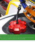 Close-up of a red CNC fuel tank cap with vent tube from Two Pack Aluminum Breather Valve Hose Kit For ATV Dirt Bikes.