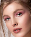Close-up of a woman with a stainless steel lip piercing taper from the 4 Piece Stainless Steel Piercing Taper Kit With Internal Threaded External Threaded And Push In Pin Insertion Pins 14G 16G 18G For Lip Nose Ear Navel Eyebrow Nipple Tongue Body Piercing Tool Set.