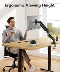 Gas Spring Monitor Arm For 13 To 34 Inch Screens Adjustable Desk Mount With VESA 75x75 And 100x100 Supports 4.4 To 22 Lbs C Clamp Or Grommet Base Ergonomic Setup For Work Or Gaming in use at desk setup.