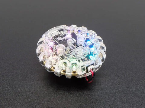 Dope Clear Shield Case For Circuit Playground Express And Bluefruit Boards Snap Fit Electronics Housing showing colorful LEDs illuminated.