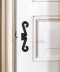 Premium Four Pack Carbon Steel Barn Door Hinge Hardware In Matte Black For Smooth Sliding Operation on a white door