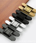 Dead Nuts Strong 3D Adjustable Concealed Door Hinges in various finishes on a wood surface for sleek operation.