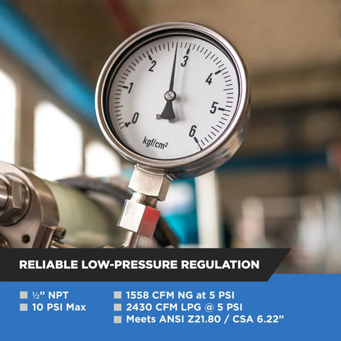 Silver natural gas regulator with round analog pressure gauge and metal inlet/outlet fittings.