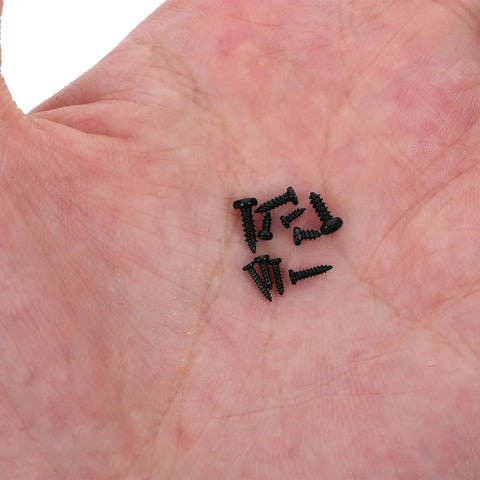 Close-up of 1000Pcs Small Round Head Self Tapping Screws Kit with Washers in hand for Precision Electronics Repair and Miniature Assembly.