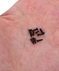 Close-up of 1000 Pcs Small Round Head Self Tapping Screws Set for Electronics Repair M1.3 M1.4 M1.5 Black Carbon Steel in hand