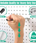 A hand placing a heavy duty metal hook into a pegboard. Text highlights rubber tip, strong welding, zinc plated. 10 Pack Pegboard Hooks Set, Heavy Duty Metal Hooks For Pegboard, 4 Inch And 6 Inch Lengths, 1/4 Inch Fit, Wall Mount Hangers For Garage, Craft Room, Office, And Workbench Storage, Pegboard Not Included.