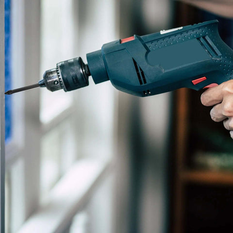 Side view of a blue cordless power drill with metal chuck and bit.
