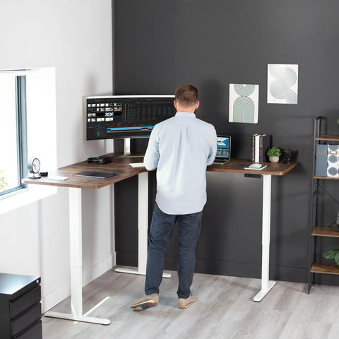 Vivo Electric L Shaped Corner Standing Desk With Memory Height Adjustment And White Finish For Office Ergonomic Sit Stand Workstation in use.