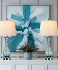 Coastal Glass Table Lamp Set Of 2, 27.5 Inch Blue Nautical Bedside Lamps With White Linen Shade on white table with blue artwork