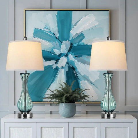 Coastal Glass Table Lamp Set Of 2, 27.5 Inch Blue Nautical Bedside Lamps With White Linen Shade on white table with blue artwork