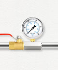 Front view of oil pressure gauge attached to brass tee adapter with red lever on a stainless steel pipe
