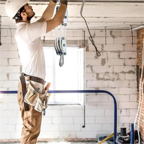 Rope Pulley Hoist System With Six To One Lifting Power And 2200 Pounds Breaking Strength Wooden Handle Construction For Built Tough Durable And Sleek Home Garage And Workshop Upgrades, installed in a garage