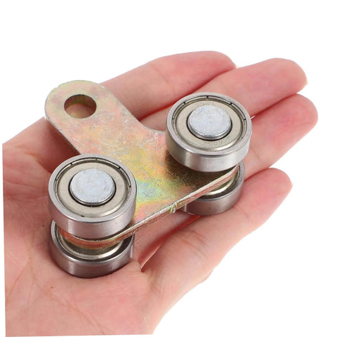 Premium stainless steel trolley rollers for sliding door track systems deliver silent, smooth operation, durable wear resistance, and effortless gliding to upgrade greenhouse, garage, and warehouse doors. Close-up view of four-wheel trolley roller in hand.