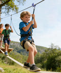 Children playing on Backyard Zip Line Kit For Kids With 250 Lb Capacity Pulley System Turns Slacklines Into Zips For Outdoor Play And Obstacle Course Safe Group Fun Durable Pulleys For Easy Setup And Rider Balance