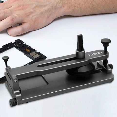 Phone LCD Display Separator Pro Tool For Quick Screen Removal on a table next to electronic components
