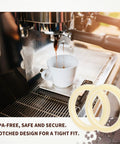 54mm Silicone Steam Ring Replacement Gasket For Espresso Machines Dope Fit On Breville And Sage Models 870 878 880 860 840 810 500 450 BPA Free Food Grade Silicone Easy Install Durable, displayed with espresso machine and coffee cup.