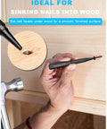 Hand holding 4-Piece Nail Punch And Center Punch Set With Hardened Cr-V Steel And Non-Slip Knurled Grips, using nail setter on wood