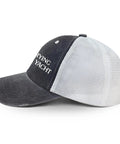 Side view of No Crying On The Yacht Hat For Grandpa An Adjustable Cool Cap with mesh back and buckle closure in black and white.