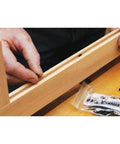 Installing wood door and panel expansion spacers 0.26 inch diameter prevent panel cracking and rattle from humidity changes