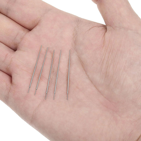 Five stainless steel pieces of the Six Pack 20G Piercing Taper Insertion Tool Set in a hand for scale.