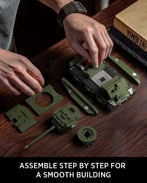 Hands assembling M4 Sherman Tank Building Kit For Adults, 860 pieces, showing modular parts and movable front section
