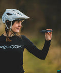 Cyclist holding multitool from Emergency Bike Repair Kit With Lightweight Cycling Toolkit Includes Multitool Air Pump Tire Levers Glueless Puncture