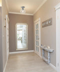 Harrow 1-Light Semi-Flush Mount Ceiling Light in chrome with clear glass shade illuminating a modern hallway.