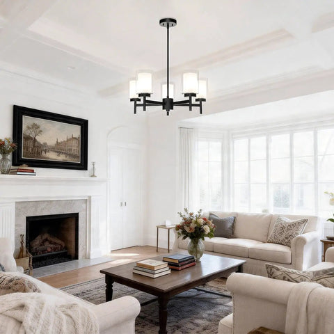 Matte Black Five Light Chandelier With Dual Glass Shades hanging in a modern farmhouse living room, slim arms, adjustable height.
